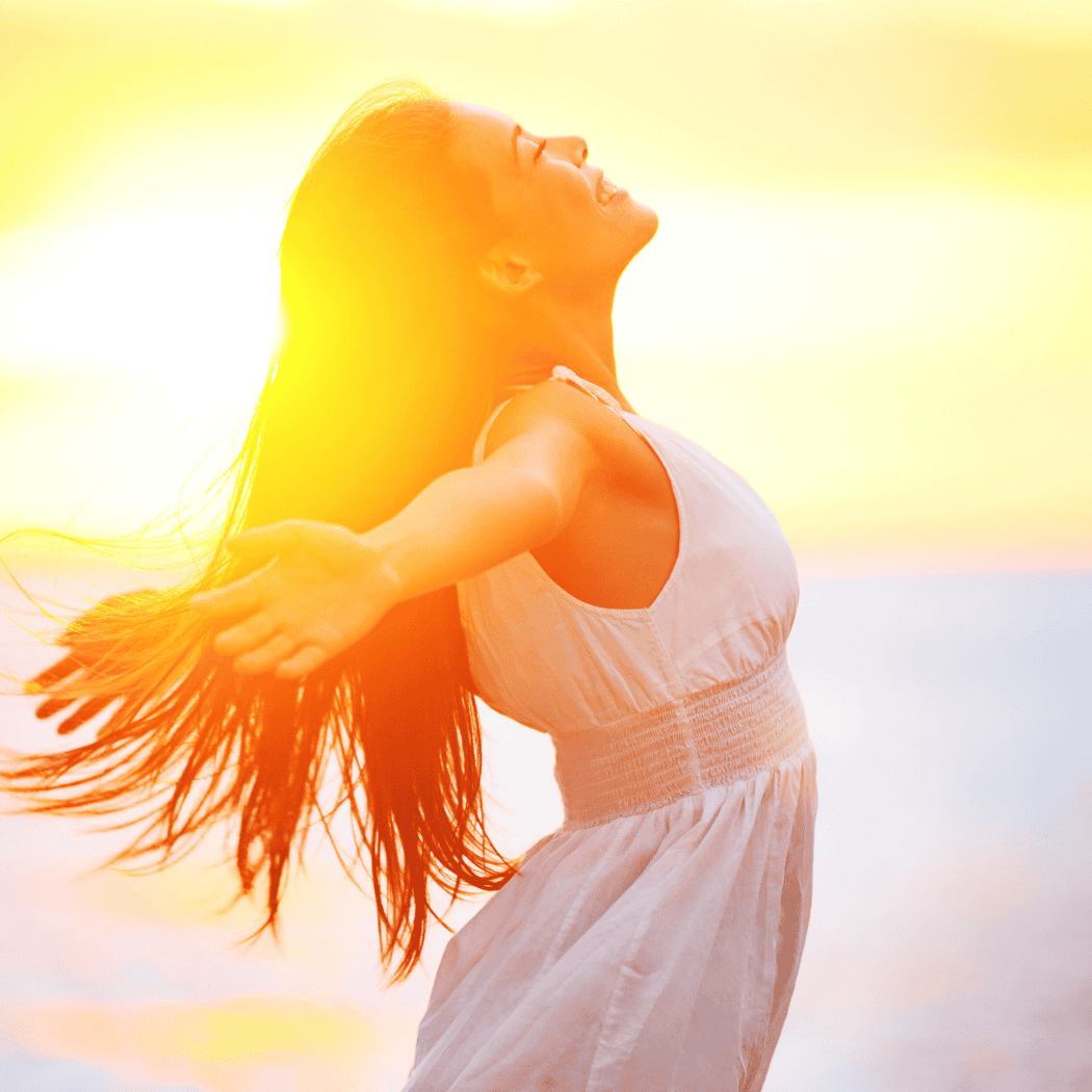 woman smiling arms open